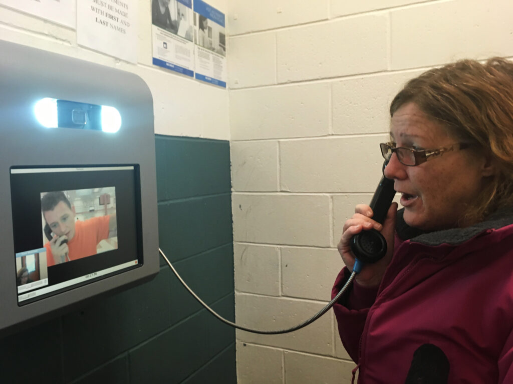 Dawn Herbert visits with her son Tommy Rogers via video call at Cheshire County Jail in Keene, N.H. Natasha Haverty for NPR